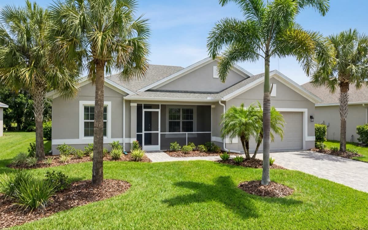 Professional exterior painting service in DeLand FL - JPL Painting applying UV-resistant coating to Florida home