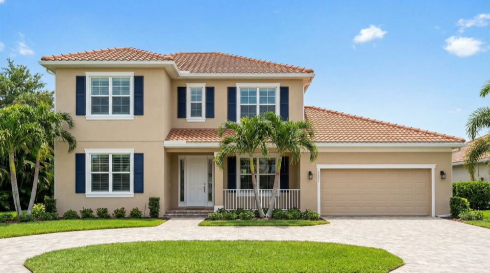 Two-story Florida stucco home freshly painted - JPL Painting exterior painting Volusia County