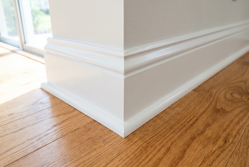 Freshly painted white baseboards in a New Smyrna Beach home